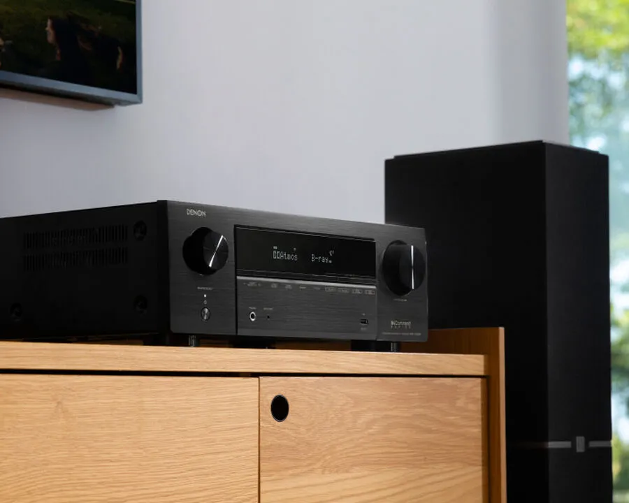 Denon AVR-X1800H lifestyle image with table